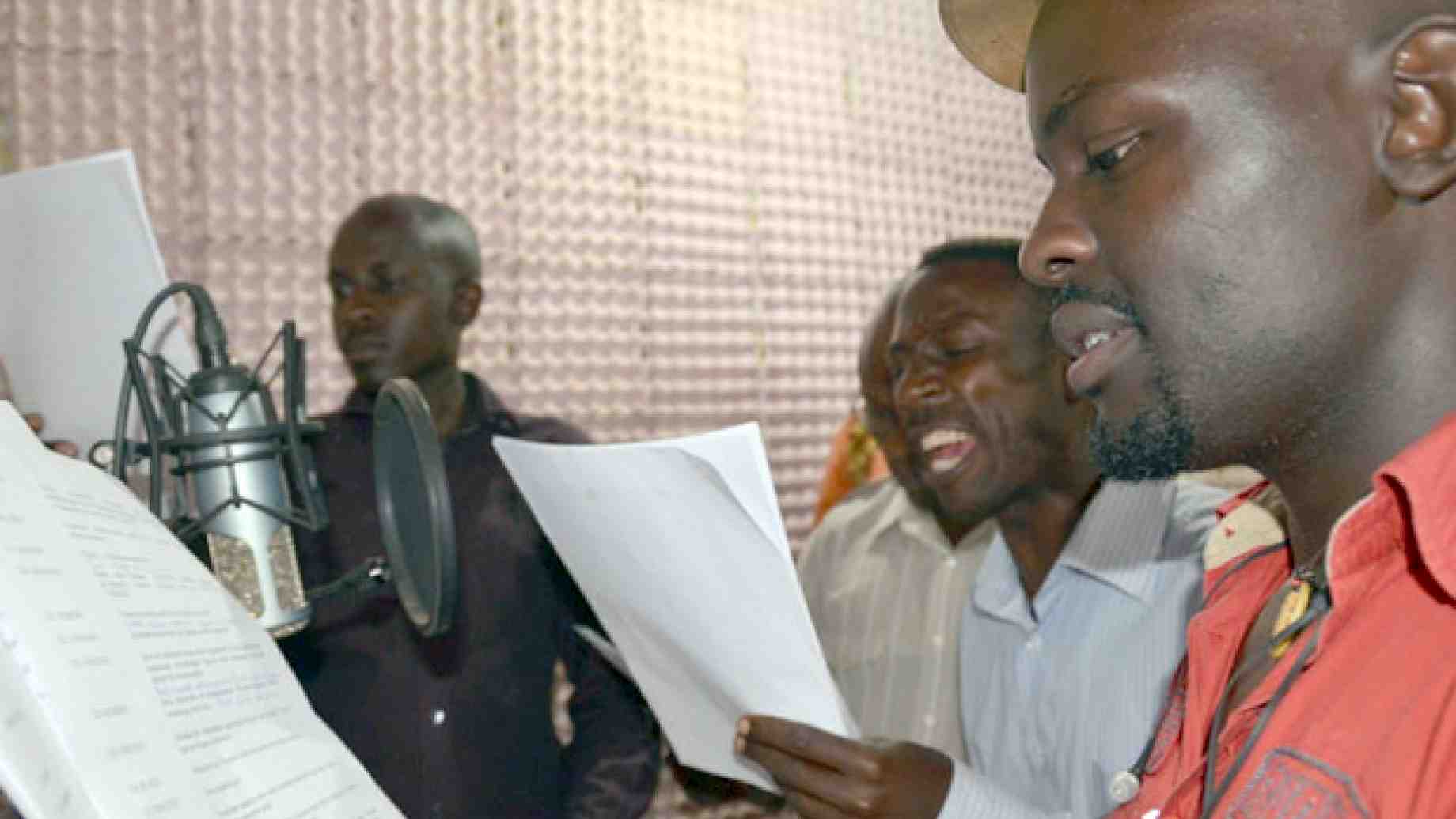 Actors performing in Rockpoint 256, a national health promotion radio drama produced by the Y.E.A.H. initiative of the Communication for Development Foundation Uganda