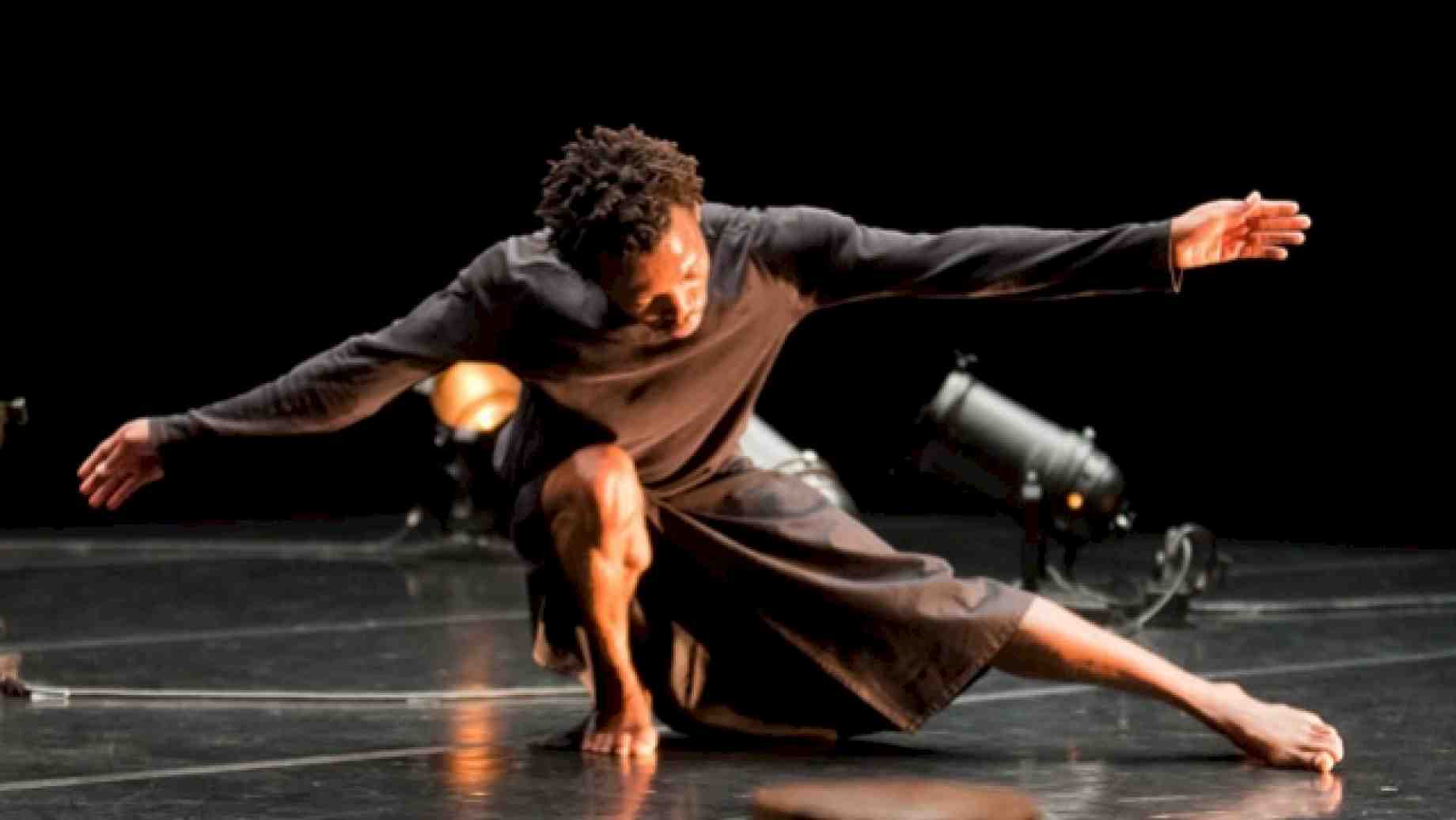 Faustin Linyekula rekindling an "idea of dance...just before or after a story," "Le Cargo."