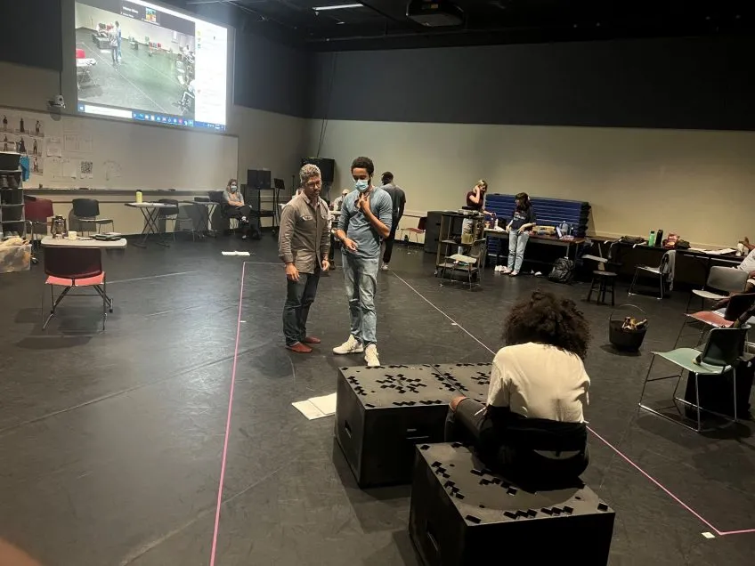 A group of actors rehearsing a play.