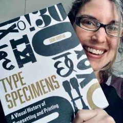 Headshot photo of Dori Griffin holding her book, "Type Specimens: A visual history of typsetting and printing"