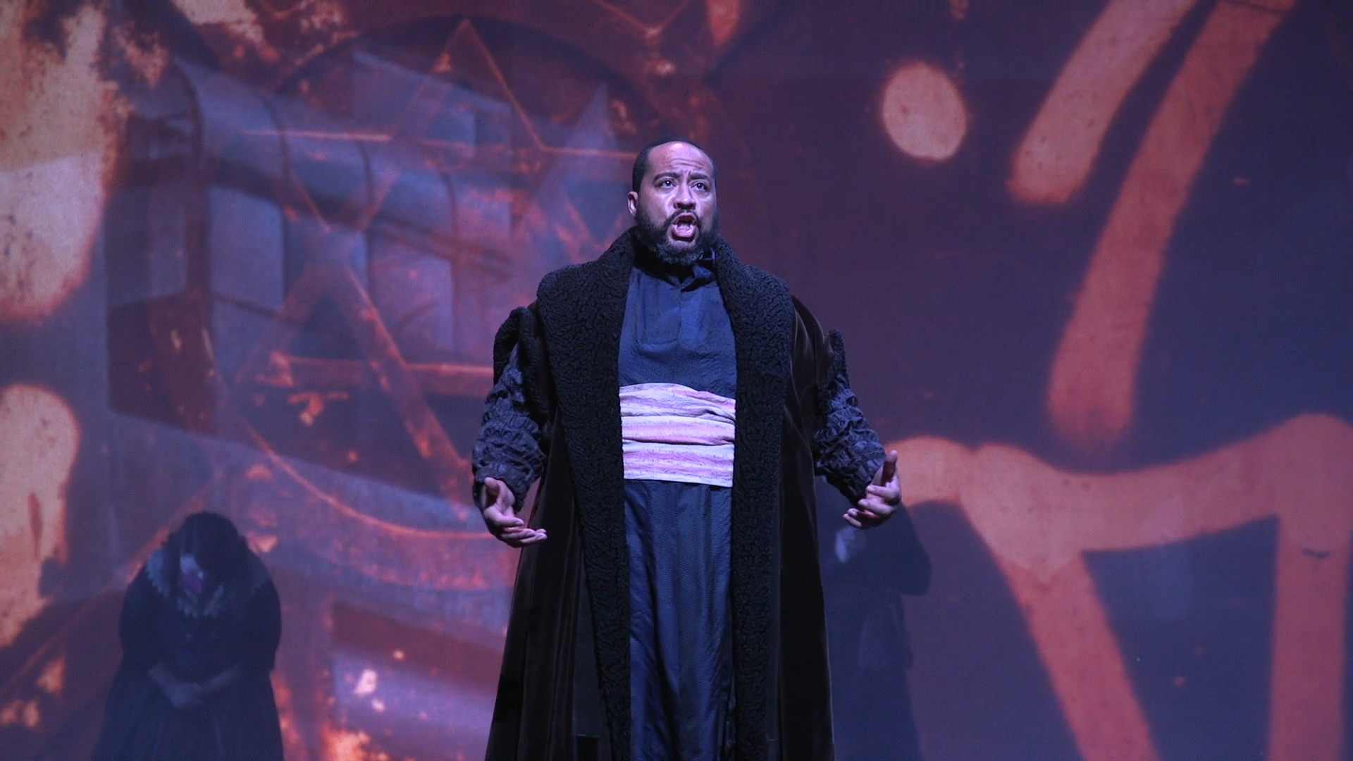 A male opera singer performs on stage