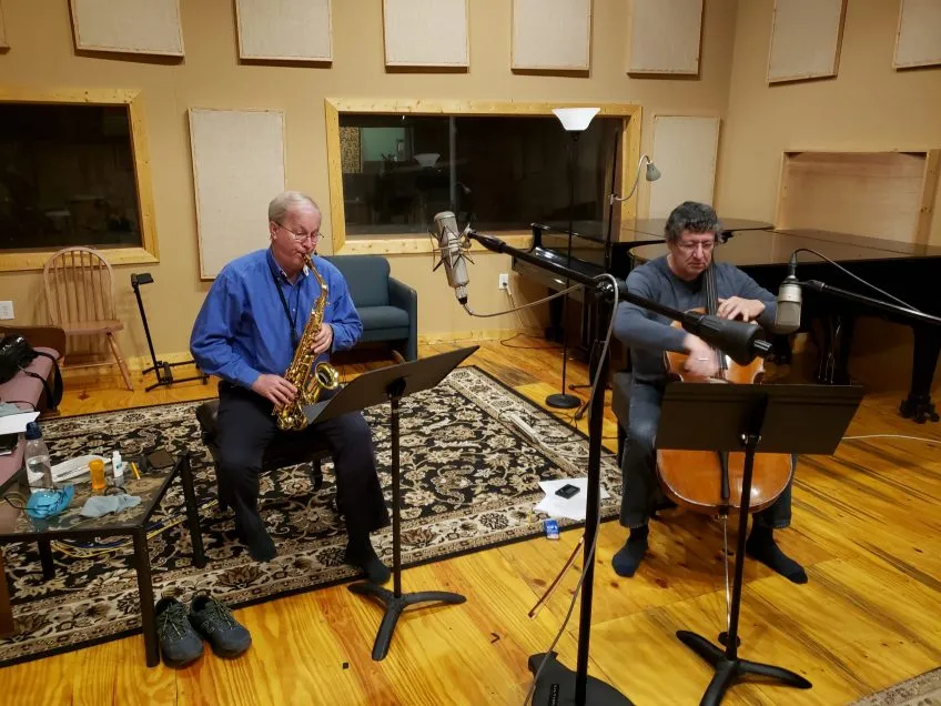 The Helton-Thomas saxophone-cello duo performing in a recording studio