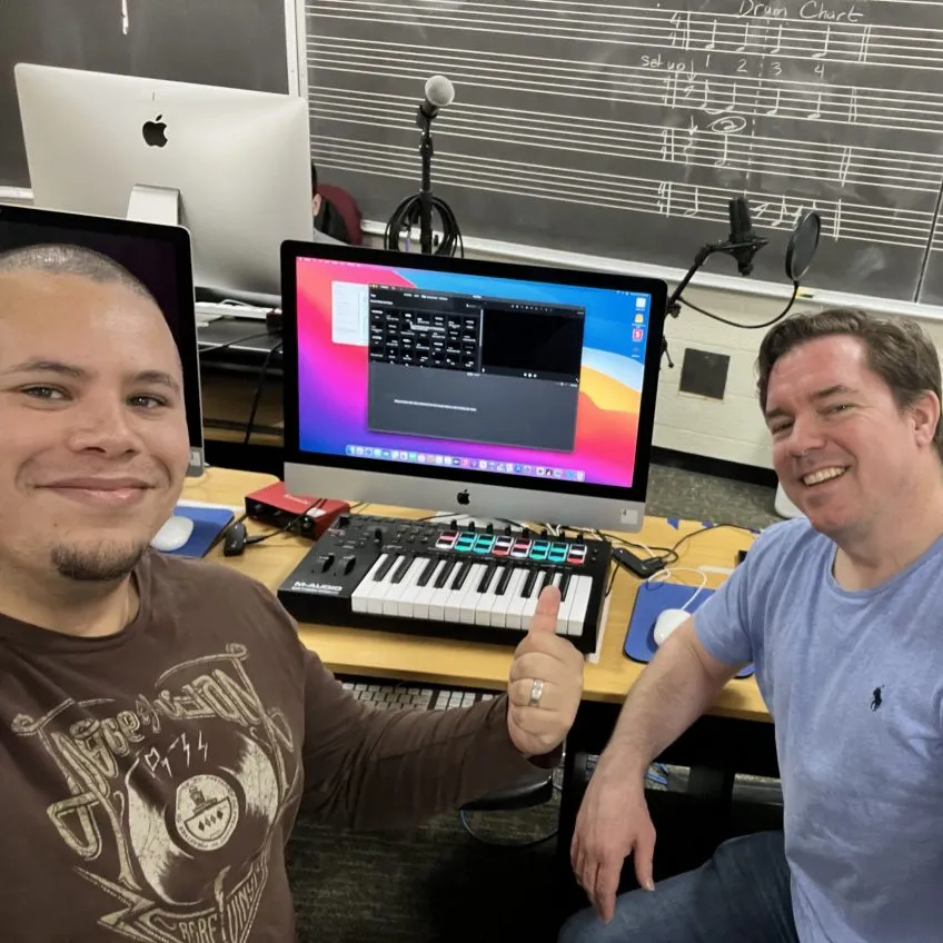 UF School of Music instuctors Jose Valentino Ruiz and Christopher Shelton in a classroom setting with audio equipment.