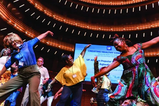 Conference attendees participate in a dance break led by the UF African Popular Music and Agbedidi Ensemble at the Creating Healthy Communities Convening.