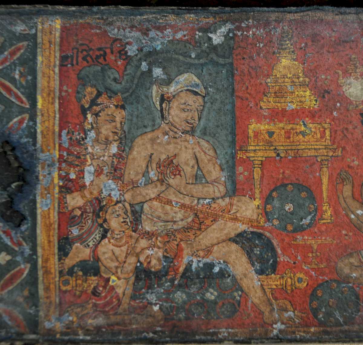 12th century Nepal manuscript illustration of a Buddhist seated master with wife and son