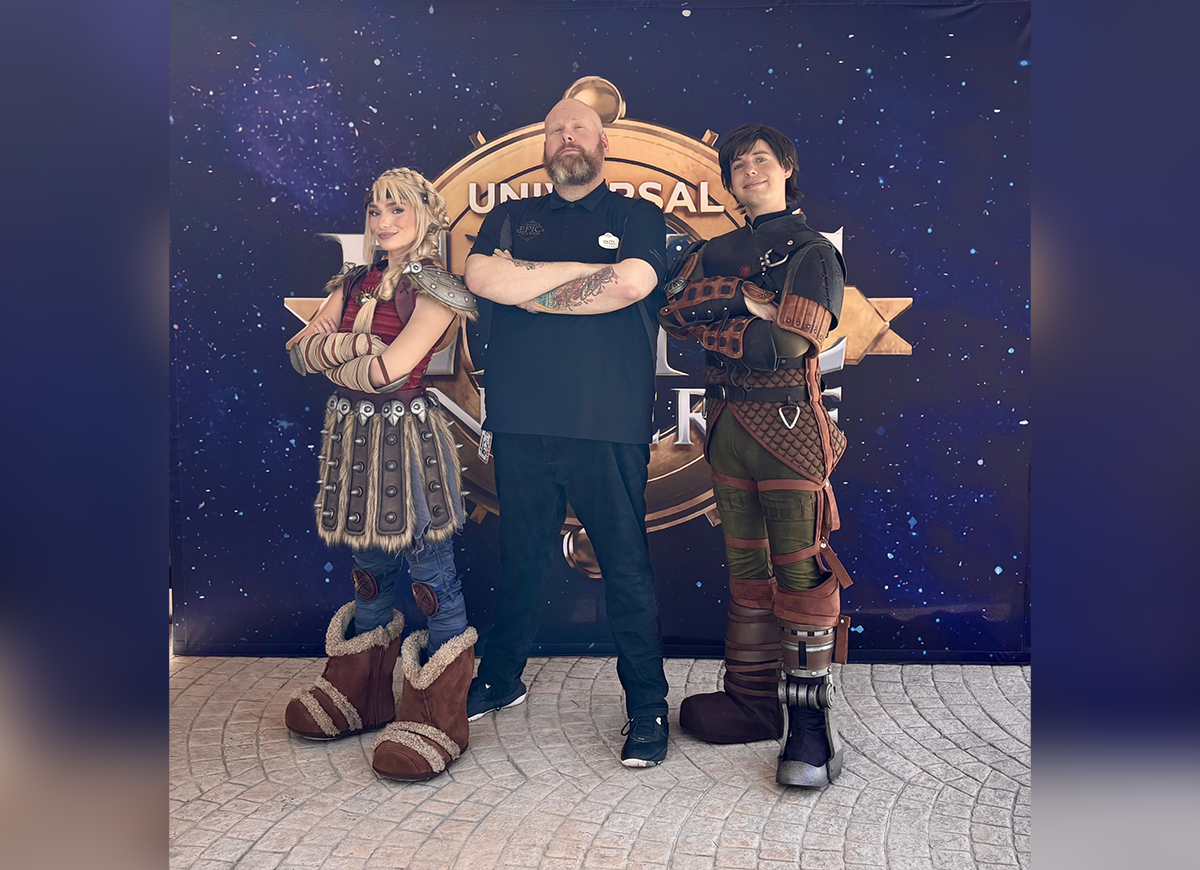 Matty Limerick stands with two costumed 