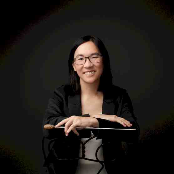 Headshot photo of Tiffany Lu with a conductor