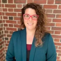 Headshot photo of Jacque Micieli-Voutsinas