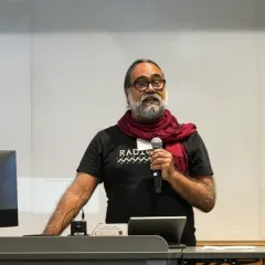 Marlon Barrios Solanos speaks into a microphone