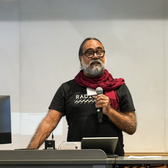 Marlon Barrios Solanos speaks into a microphone