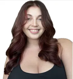 Selfie of Maria. Maria has medium length red-brown hair. Maria is wearing a black top.