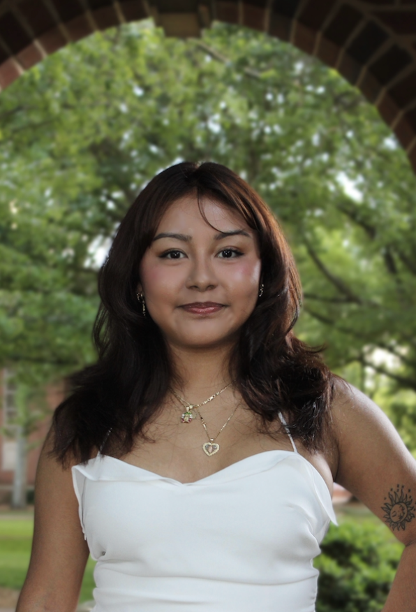 Citali Navarrete headshot photo. Citlali has shoulder length brown hair and is wearing a white dress