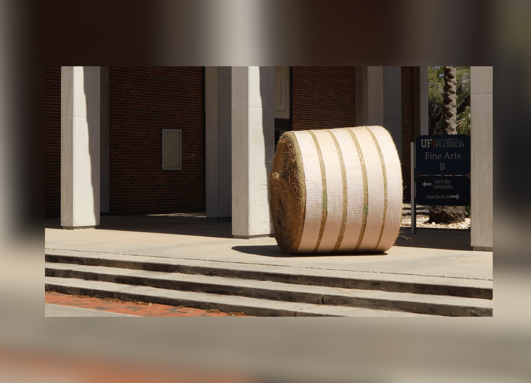 A hay bale on the steps of Gary R. Libby University Gallery. From the art installation "In the Fields," 2025, by Rosemary Springer.