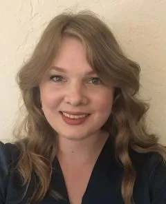 Selfie of Danielle. Danielle is wearing a dark shirt and has shoulder length blonde hair