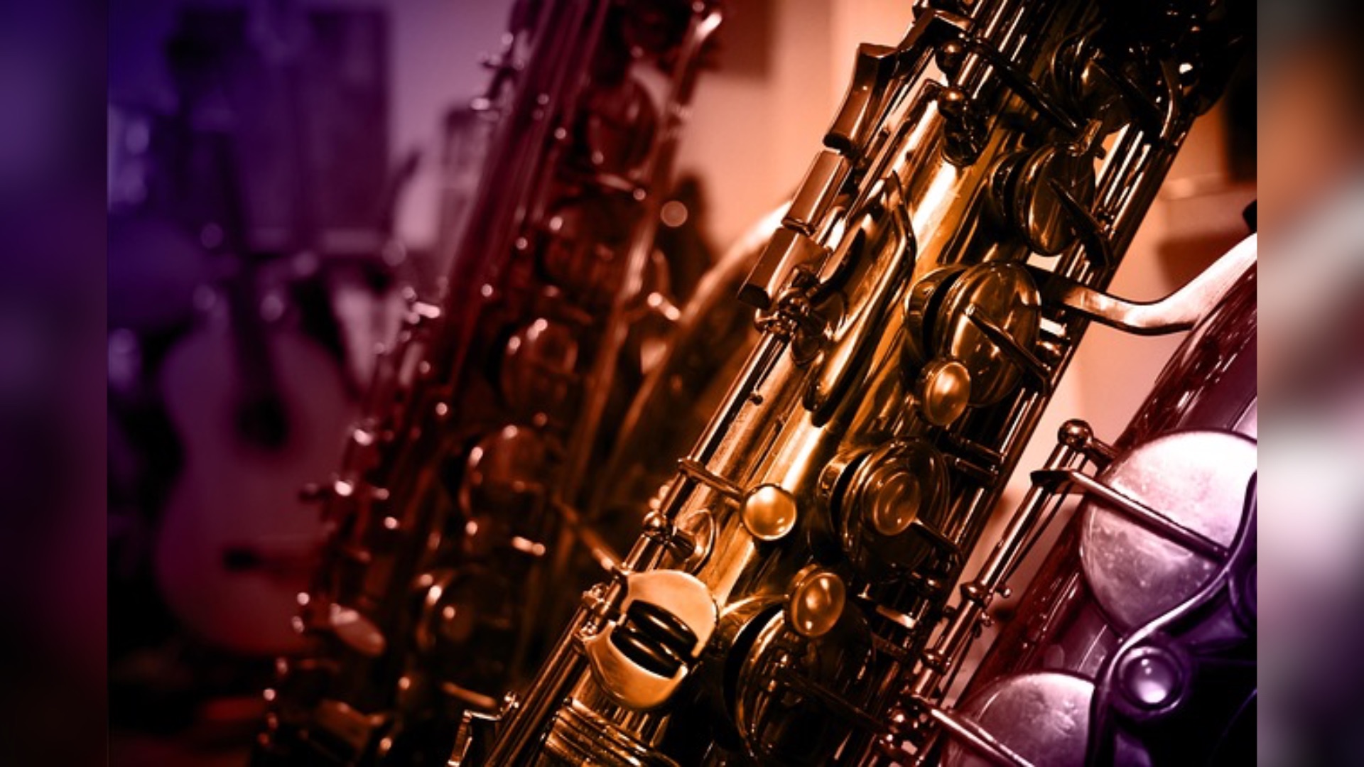Close up image of multiple saxophones