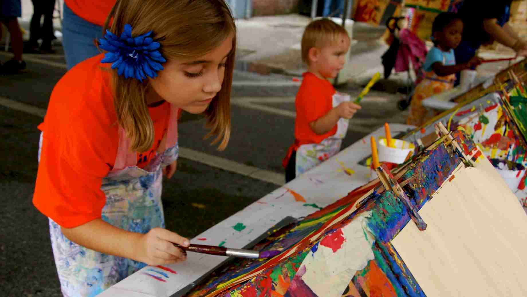 The painting easels are always a popular activity area at the annual Imagination Station sponsored by the UF Art Education program each Fall.