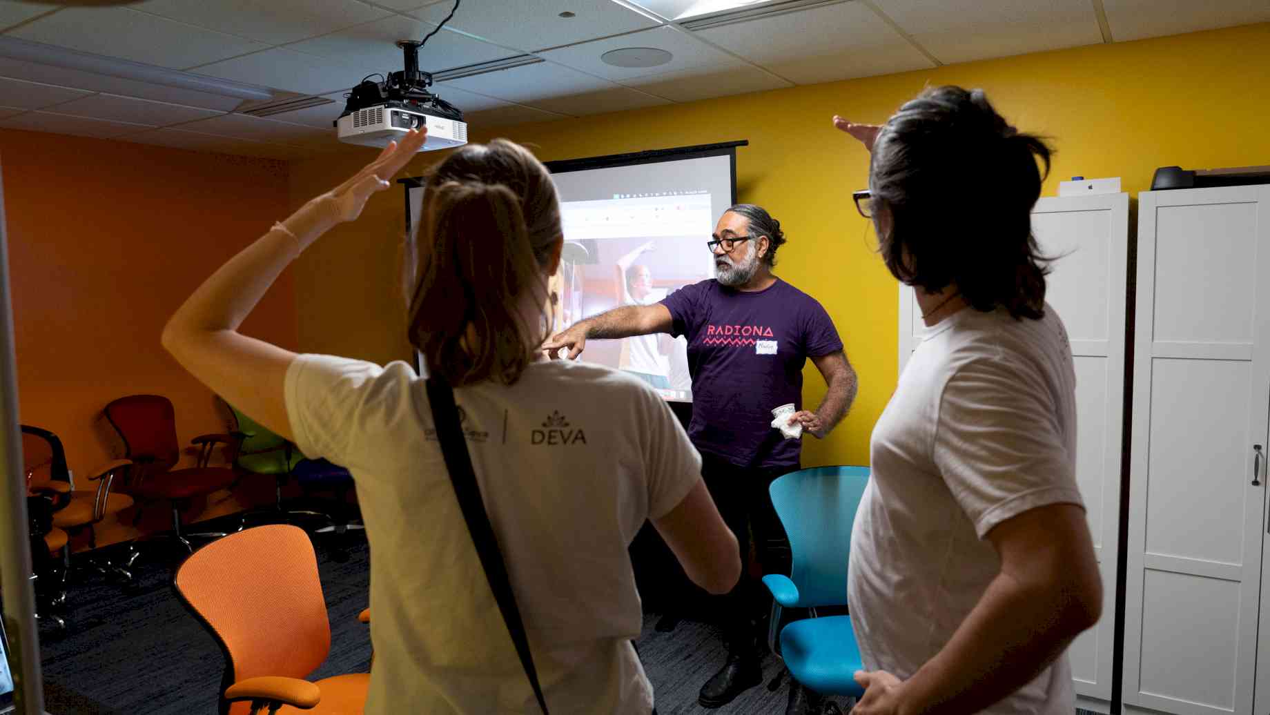 Marlon Barrios Solano demonstrates his interactive AI platform to CAME visitors. Photo by Ravyn Gale.