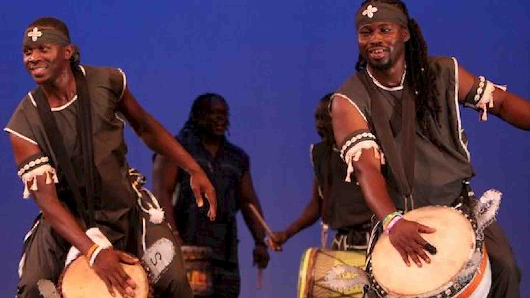 Adjunct Faculty member, Aboubacar Soumah (left), and Artist-in-Residence, Fode Moussa Camara (right), rock the djembe in performance.