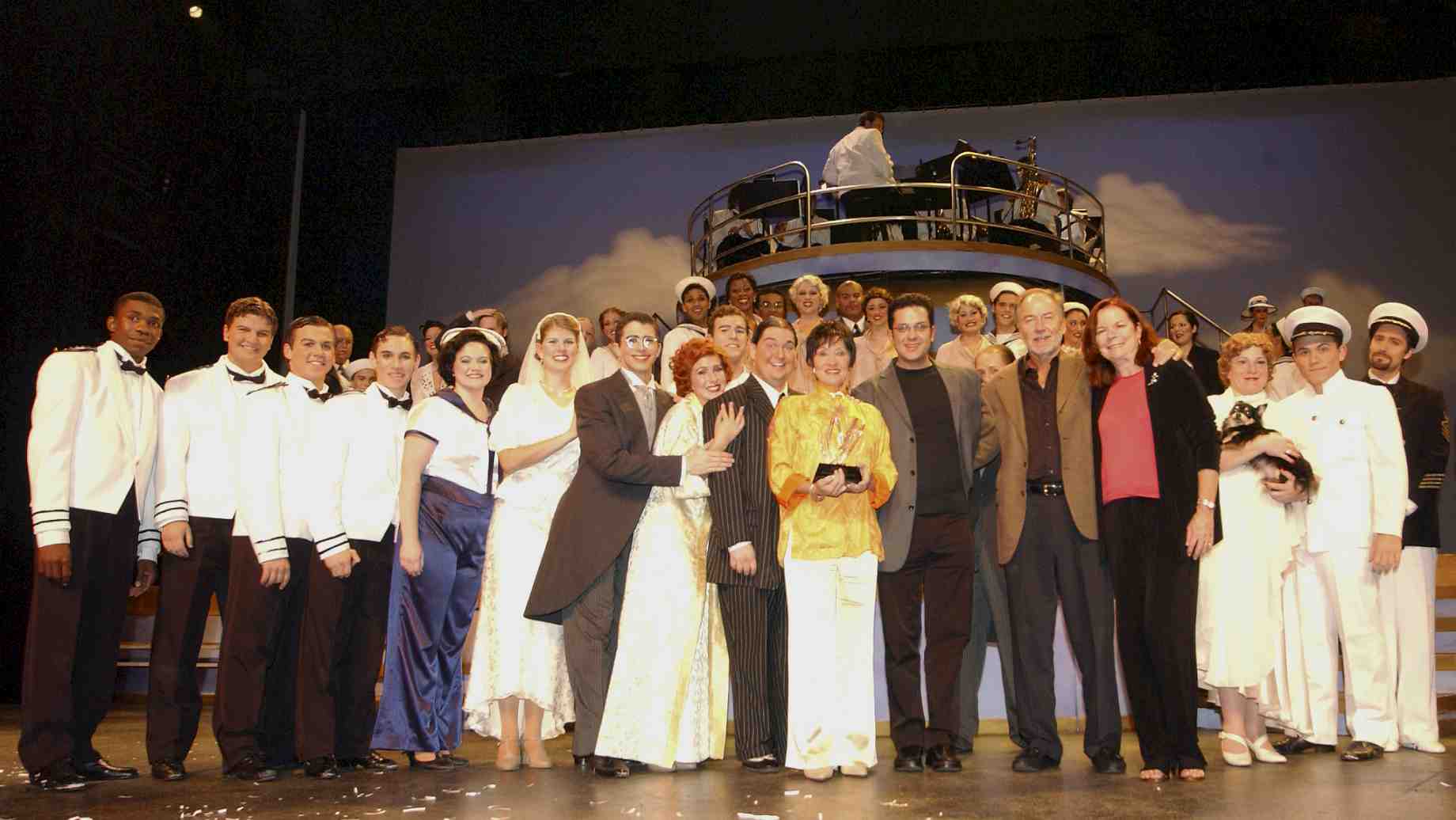 Chita Rivera with the cast of Anything Goes and George and Linda Wilson.